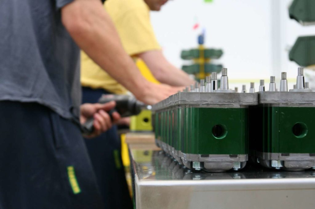 Vivoil workers assemble hydraulic motors and pumps